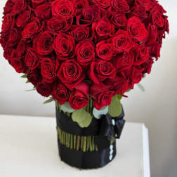 Large bouquet of red roses in a black wrap