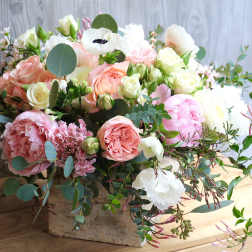 Mixed pastel bouquet in a rustic wooden box