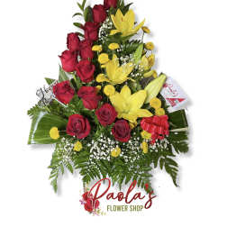 Tall bouquet of red roses and yellow lilies with a birthday pick