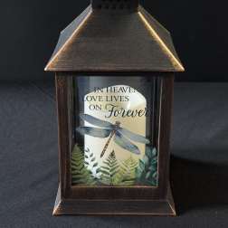 Decorative lantern with a candle and memorial text