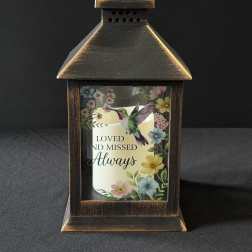 Decorative lantern with a memorial candle and floral print