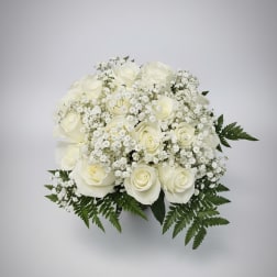 White rose bouquet with baby's breath and fern foliage
