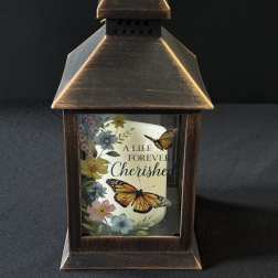 Decorative lantern with a memorial candle and butterfly floral print