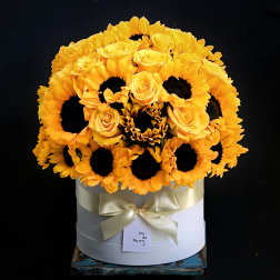 Yellow sunflower and rose arrangement in a white hat box with a ribbon