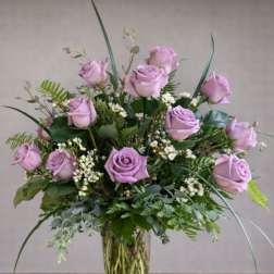 Lavender rose arrangement in a clear glass vase