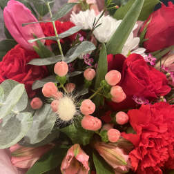 Bouquet of red and pink flowers with white daisies and eucalyptus