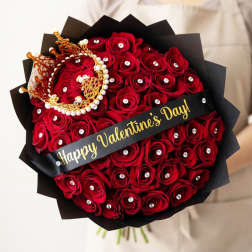 Bouquet of red roses with black wrapping and a Happy Valentine's Day ribbon