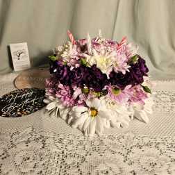 Round bouquet of pink, white, and purple daisies with birthday picks