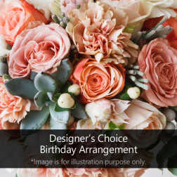 Pink and peach roses with carnations and succulents in a mixed bouquet.