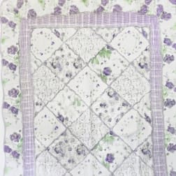 Quilt with purple rose floral print and patchwork center panel