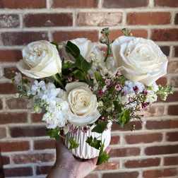 White rose bouquet in a ribbed white vase