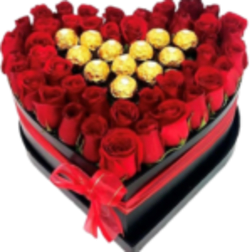 Heart-shaped box filled with red roses and gold-wrapped chocolates