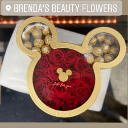 Mickey Mouse-shaped box filled with red roses and gold-wrapped chocolates