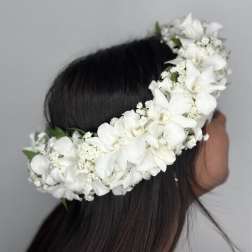 White floral crown worn on a person's head
