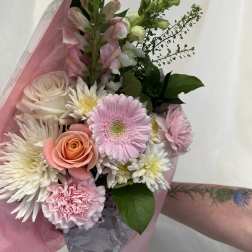 Pink and white mixed bouquet with roses, gerbera daisies, and carnations
