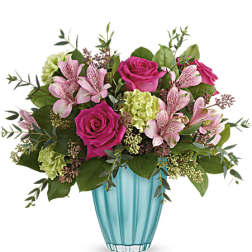 Pink roses and alstroemeria in a turquoise vase