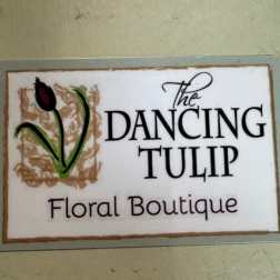 Sign reading The Dancing Tulip Floral Boutique with a tulip graphic