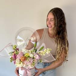 Birthday flower arrangement with a clear balloon and pink ribbon in a white box