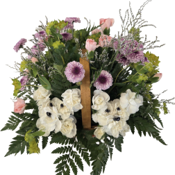 Pink and white floral arrangement with purple blooms in a wooden easel frame