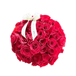 Round bouquet of red roses with a white ribbon bow