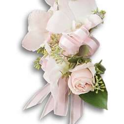 Pink and white floral corsage with ribbon ties