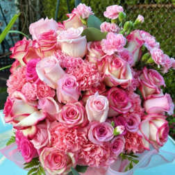 Pink rose and carnation bouquet in a ribboned box