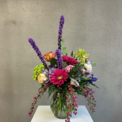 Colorful mixed bouquet in a clear glass vase