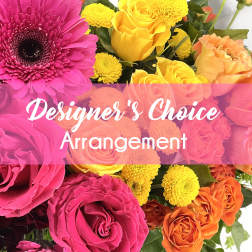 Bright mixed bouquet with pink gerbera daisies, yellow and orange roses, and yellow pom flowers