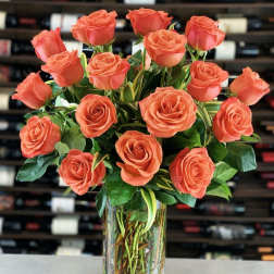 Bouquet of coral roses in a clear glass vase