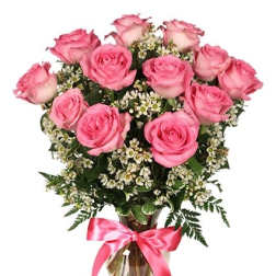 Pink roses in a glass vase with a pink ribbon