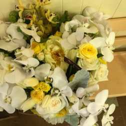 Bouquet of white orchids and yellow roses