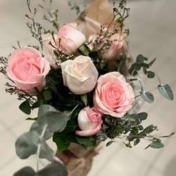 Bouquet of pink and white roses with eucalyptus