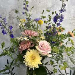 Mixed bouquet with pink roses, yellow chrysanthemums, and purple flowers