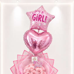 Pink baby shower bouquet with a star balloon, heart balloon, and roses