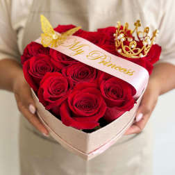 Heart-shaped box of red roses with a "My Princess" ribbon and gold crown toppers