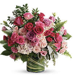 Pink and lavender rose bouquet in a glass vase