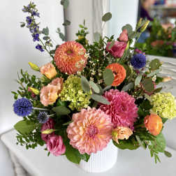 Colorful mixed bouquet in a white ribbed vase