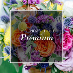 Mixed bouquet with orange roses and purple thistle-like flowers