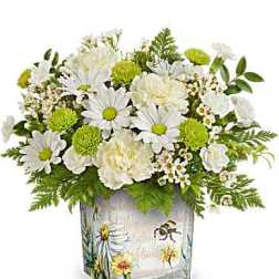 White daisies and green pom flowers in a painted glass vase