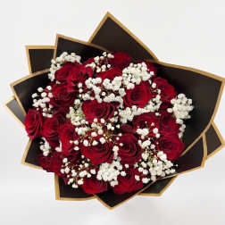 Bouquet of red roses with white baby's breath in black and gold wrap