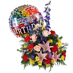 Birthday balloon with colorful flower arrangement of pink lilies, roses, red carnations, and yellow daisies