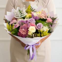 Handheld bouquet of pastel roses, chrysanthemums, and a silver tiara