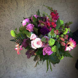 Mixed bouquet of pink, purple, and green flowers