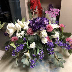 Large purple, white, and pink floral arrangement with a Happy Mother's Day sign