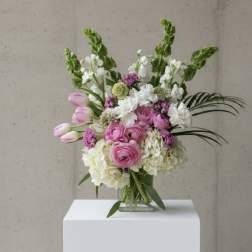 Pink and white mixed bouquet in a clear glass vase