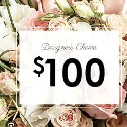 Blush and white roses with a $100 designer choice sign
