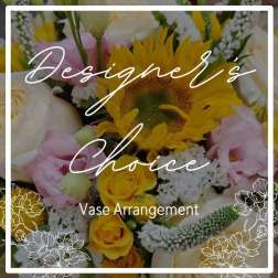 Mixed bouquet with sunflowers, yellow roses, and pink blooms