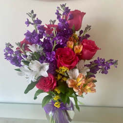 Celebrate Your Day with mix flowers arranged in a vase.