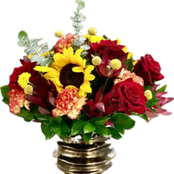 Bouquet of red roses, a sunflower, and carnations in a metallic vase