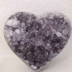 Heart-shaped crystal ornament with purple and clear stones